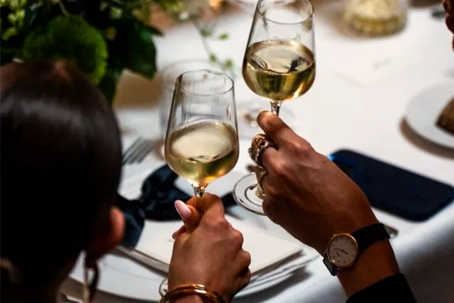 A toast at a private dinner